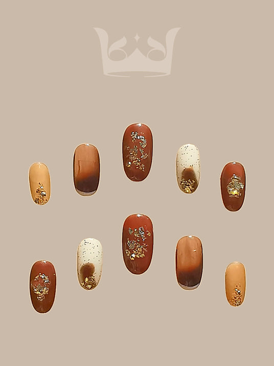 These press-on nails offer a range of earthy tones, artistic embellishments, and varying lengths for a fashionable and cute manicure. Suitable for different preferences.