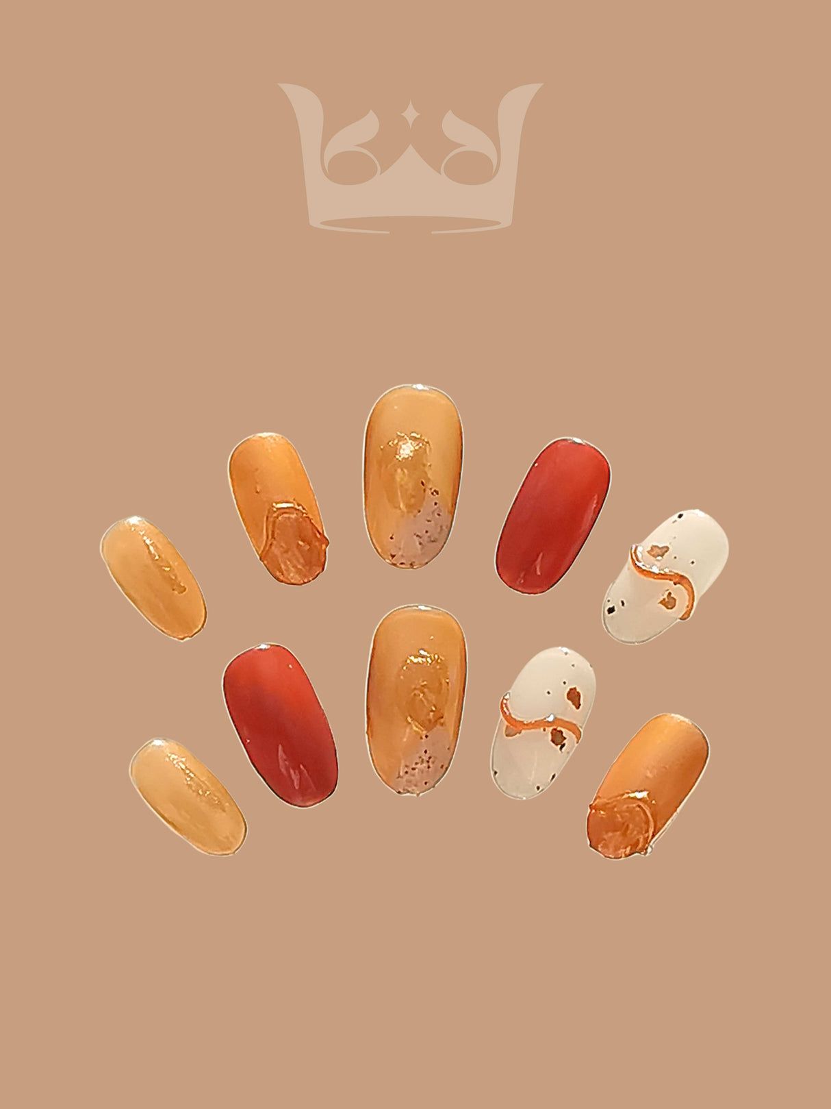 These press-on nails have a warm color palette, solid colors with metallic or glossy finishes, a marble effect with gold flakes, and accent nails for a dynamic look.