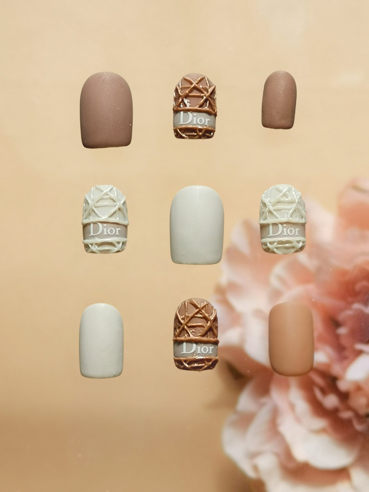 These Dior nails are perfect for luxury-themed nail art, with a neutral color palette and matte finish suitable for formal events or high-end fashion shows.