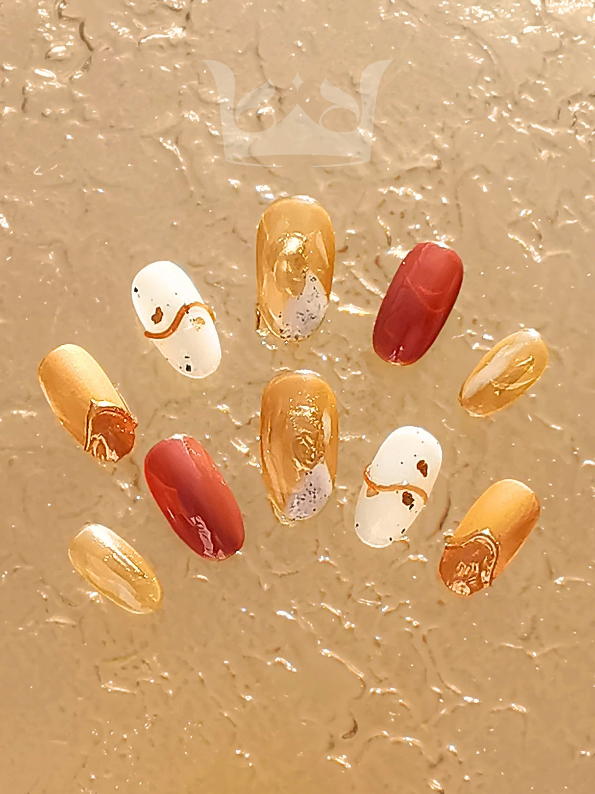 Luxurious and festive nails for special occasions with gold, white, and red color palette, metallic finishes, dripping gold accents, and glitter decorations. Perfect for formal events.