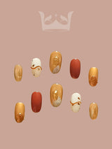 Gold and terracotta nails with metallic, shimmery, and matte finishes, artistic embellishments, and French manicure twist for those who want to make a fashion statement.