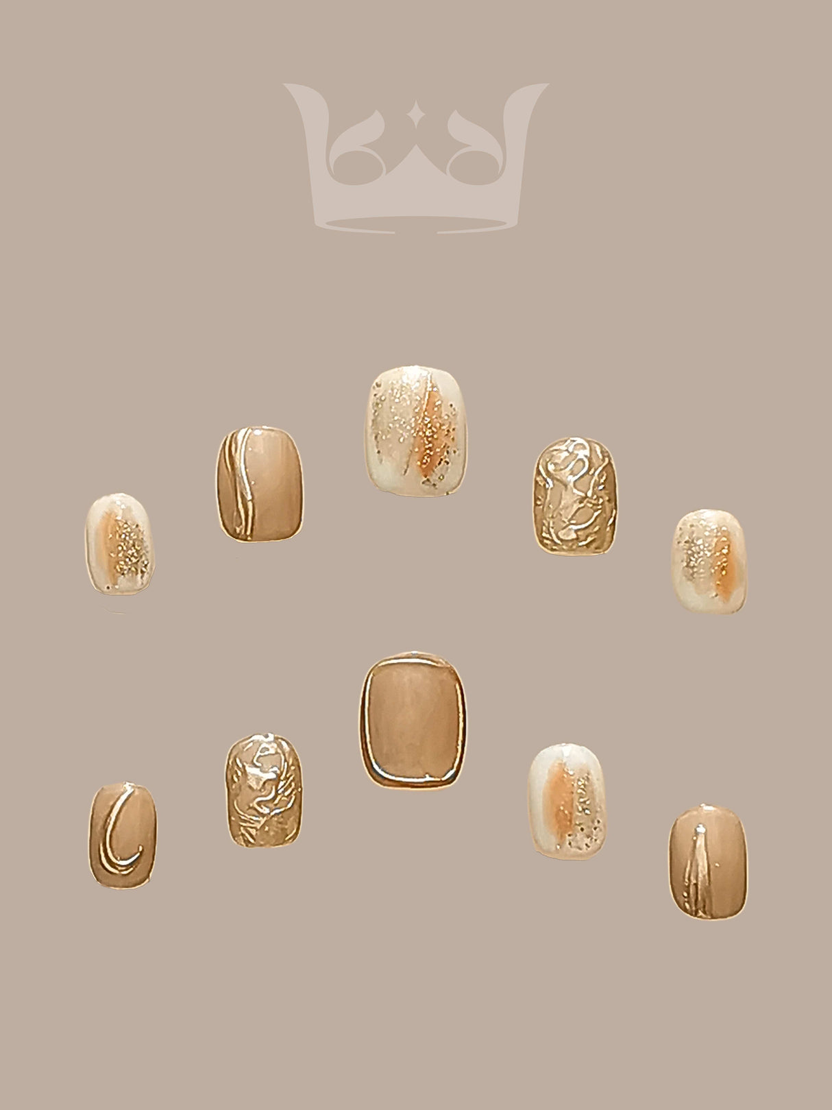 These press-on nails have a minimalist design and gold accents that complement a variety of outfits. They feature a luxurious aesthetic with gold foil, glitter, and marble-like effects.