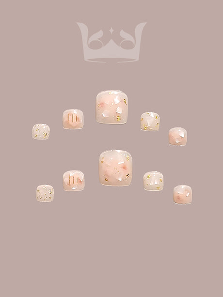 These press-on nails are perfect for special occasions like weddings or proms, with a delicate and whimsical celestial theme featuring pastel pink, gold foil, and geometric designs.