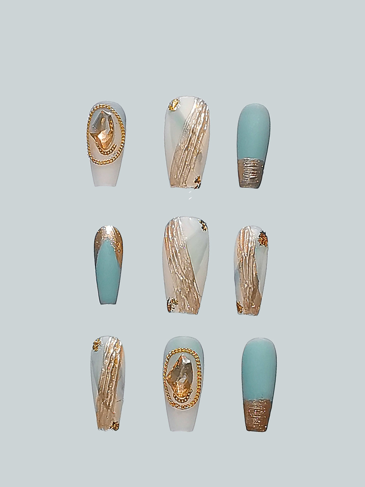 Elegant pastel blue, white, and gold accent nails with different lengths and shapes for customization. Perfect for special occasions or fashion statements.