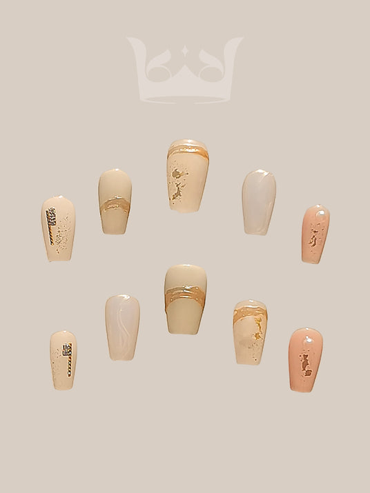 Sophisticated and elegant nail art design with gold foil accents, negative space, embellishments, modern French tip, and glossy finish for special occasions.