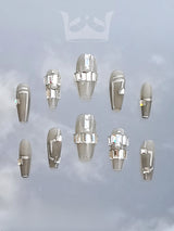 These high-end fashion nails are for those who want to make a statement with trendy designs, pearls, rhinestones, and chains. 